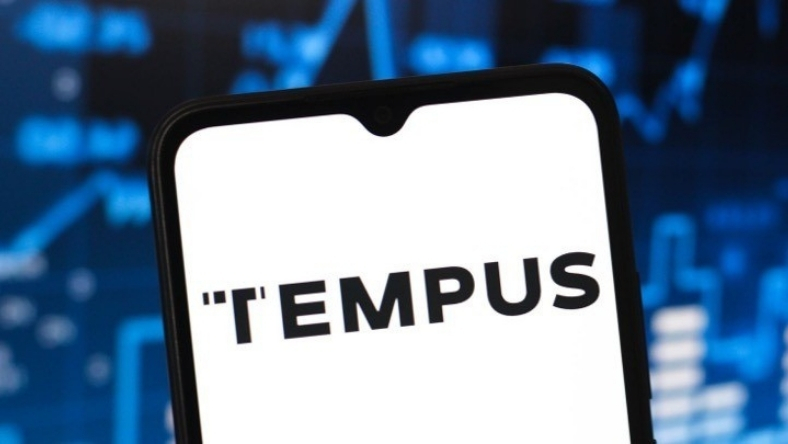 Tempus AI branding on a smartphone, highlighting AI-driven cancer analytics