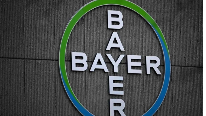 Bayer logo mounted on textured exterior building wall